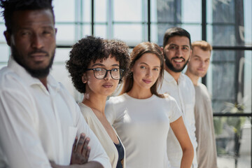 Portrait of smiling African American business man with executives working in background