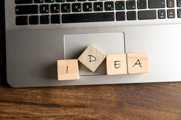Wooden cubes and idea on notebook