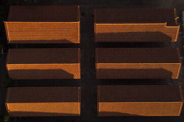 Topdown aerial view of six roofs.