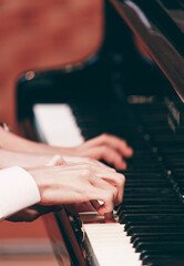 Obraz premium Indoor concert background abstract people playing music instruments in symphony orchestra piano dual performance arts rehearsals chamber music