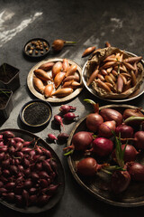 A beautiful still life of various varieties of onions in the sun's rays