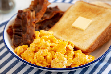 Homemade American Scrambled Egg Breakfast on a Plate, low angle view. Close-up.