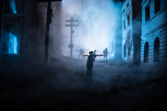 Military soldier silhouette with bazooka. War Concept. Military silhouettes fighting scene on war fog sky background, Soldier Silhouette aiming to the target at night. Attack scene