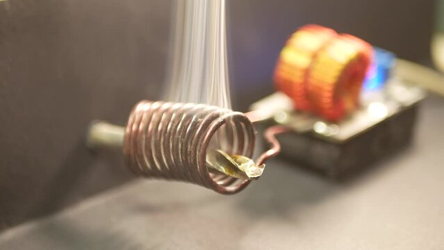 The induction heater heats the metal drill bit