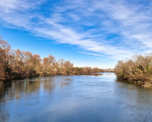 A Mesmerizing View of the Garonne River Gracefully Passing Through the Enchanting City of Toulouse, Embracing the Urban Landscape with Serenity and Reflecting the City's Charms in its Gentle Waters