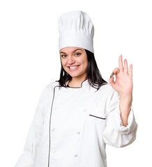 Young caucasian cook woman isolated joyful and carefree showing a peace symbol with fingers.