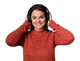 A woman listens to music through headphones, feeling and enjoying the sound. She is relaxed and happy, experiencing pleasure and delight