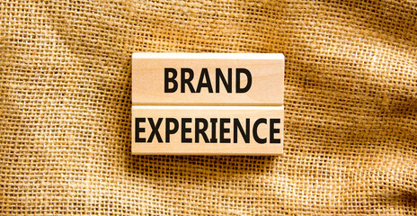 Brand experience symbol. Concept words Brand experience on wooden blocks. Beautiful canvas table...