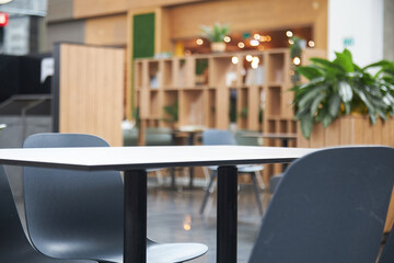 empty cafe table Empty wood table top and blur glass window interior restaurant banner mock up abstract background - can used for display or montage your products..