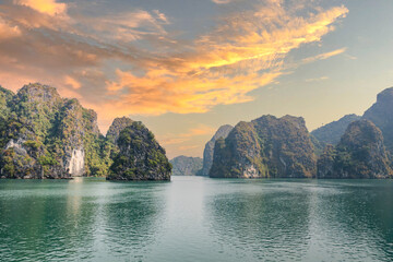 Halong Bay, Vietnam, with limestone hills and sunset sky. landscape of Ha Long bay with sunset sky,...