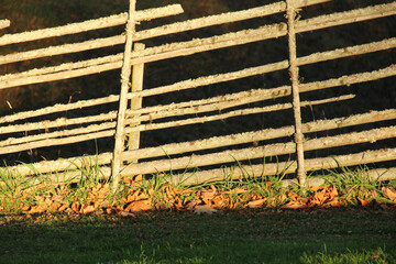 Old Swedish fence in sunlight in autumn