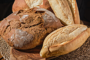 Traditional pastries in Turkey, fresh bread on the bakery counter. Natural lighting, delicious pastries on the table, close-up, selective focus. Homemade whole grain bread