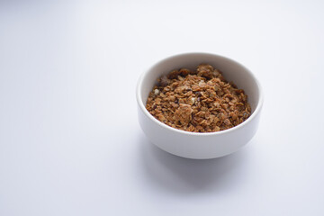  granola Musli in a bowl on white background 
