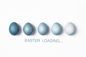 Dyed Easter eggs color gradient as loading bar. Easter is coming concept. Text Easter Loading on white, minimal style.