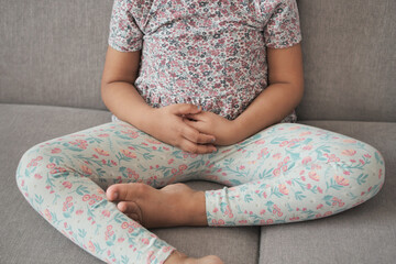 Fototapeta premium child suffering stomach pain close up.