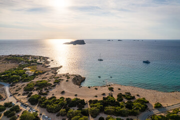 Fototapeta na wymiar Aerial photographs of the beaches of Cala Escondida, on the island of Ibiza during a sunny summer day with blue sky and turquoise water