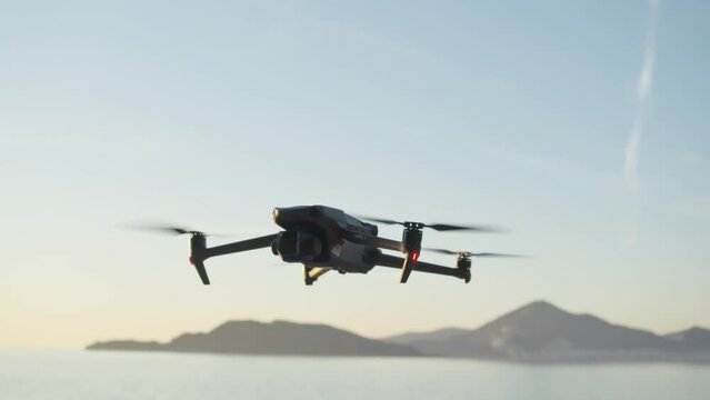 Montenegro, january 2023: drone mavic 3 landing, sea and mountains on background. filmmaker traveling with drone