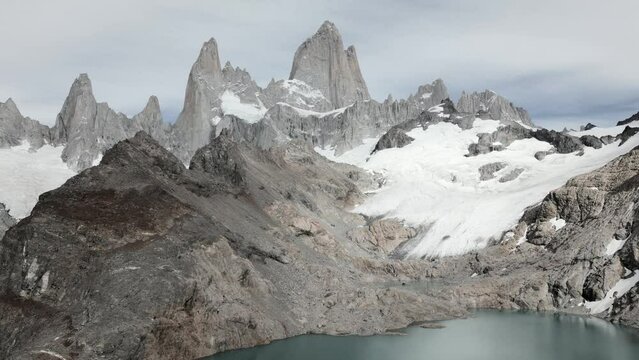 Drone footage of the stunning Laguna de los Tres with its turquoise waters surrounded by Mount Fitz Roy and icefields - famous sight when hiking in El Chalt&eacute;n, Patagonia, Argentina - natural look