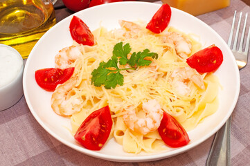Pasta with shrimps, tomatoes and parmesan cheese