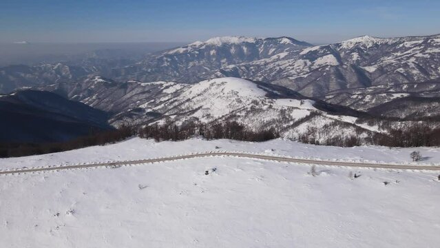 Old Mountain Balkan Stara Planina Babin Zub tourist resort in winter day covered with snow empty road