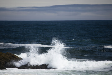 Ocean waves crashing on a rocky shore