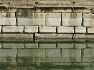 The Reflection of The Stone Bricks of A Roman Pool