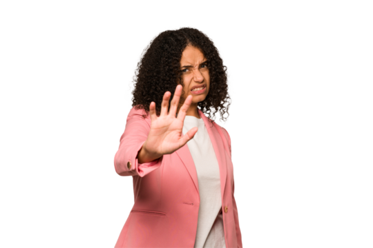 Young african american curly woman isolated rejecting someone showing a gesture of disgust.