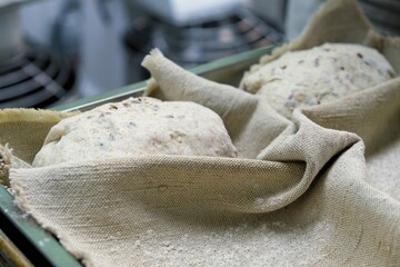 baker at work. The baker shapes the bread. Hands on the close-up form bread