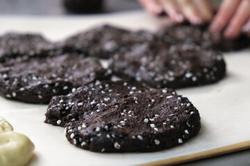 baker at work. The baker shapes the bread. Hands on the close-up form bread