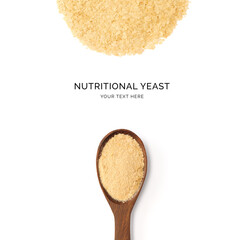 Creative layout made of nutritional yeast on the white background. Flat lay. Food concept. Macro ...