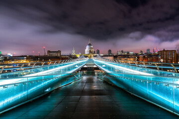Obraz premium Millennium bridge and dome of St. Paul's cathedral in London. England