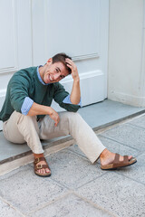 Stylish man, sitting.