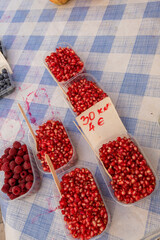 Baskets of refreshing and threshed pomegrates for sale at the street fair in the square in the center of Dubrovnic, Croatia