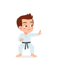 cute little kid training and showing karate pose