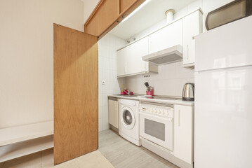 Studio apartment with kitchen behind oak doors and polished marble floors