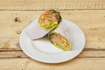 A wrap is a variant of the taco or burrito that includes typical sandwich fillings wrapped in a tortilla, pita, lavash, or other soft flatbread