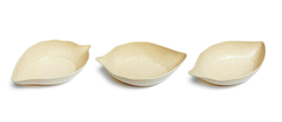 a serving bowl in the shape of a leaf isolated on white background