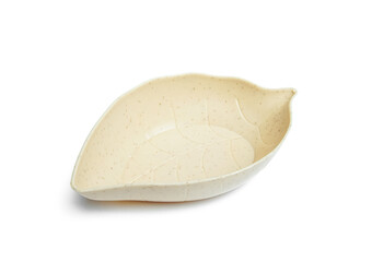 a serving bowl in the shape of a leaf isolated on white background