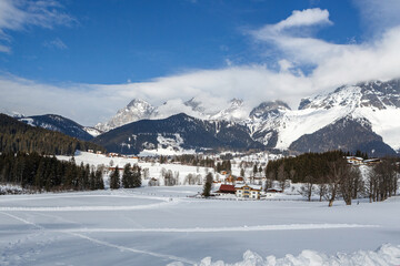 Fototapeta na wymiar Beautiful snowy winter landscape around Ramsau and mount dachstein in austria
