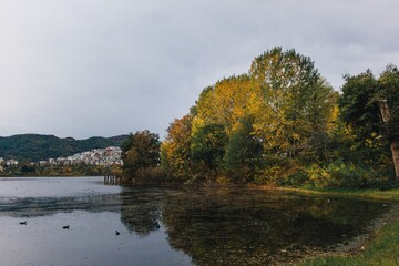 Fototapeta premium Landscape lake view in autumn. Artificial Lake of Tirana, Albania.