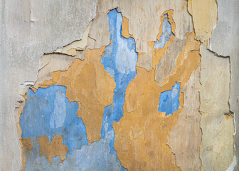 Peeled wall texture for background. Abstract pattern of blue and orange hue.