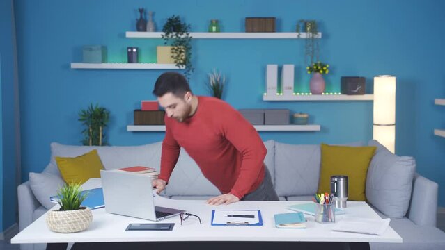 Man Showing How To Exercise In Modern Home Office. They Relax By Doing Sports Standing Up.
A Man Working In A Modern Home Office Shows The Camera Step By Step How To Exercise His Body.
