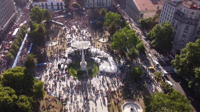 Aerial drone flying over iconic Plaza de Mayo during march of LGBT Pride Parade in Buenos Aires, Argentina