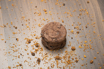 Chocolate chip cookies on dark wooden background