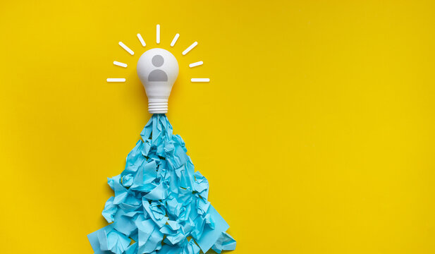 Ideas,inspiration concepts with rocket light bulb and sticky note on yellow background.