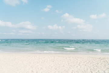 Fototapeta na wymiar Seascape abstract beach background. calm sea and sky. Focus on sand foreground. vintage color tone.