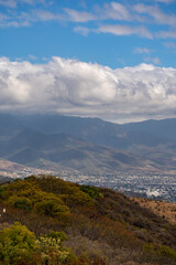 Beautiful view of the large Mexican city of Oaxaca from Monte Alban. View of the endless mountain peaks.