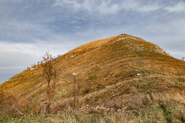 A walk through the mountains with a view of the mountains. Mountain landscape with beautiful Caucasian nature. View from a great height in a picturesque place of the Caucasus. A mountain landscape.