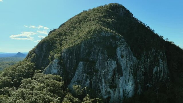 Aerial towards the steep cliffs of volcanic cone Mt Cooroora Australia