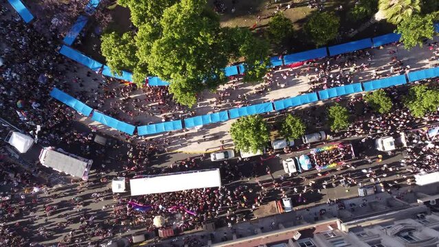 Overhead view of LGBT Gay Pride Parade march in Plaza de Mayo in Buenos Aires downtown. Looking down aerial drone top down